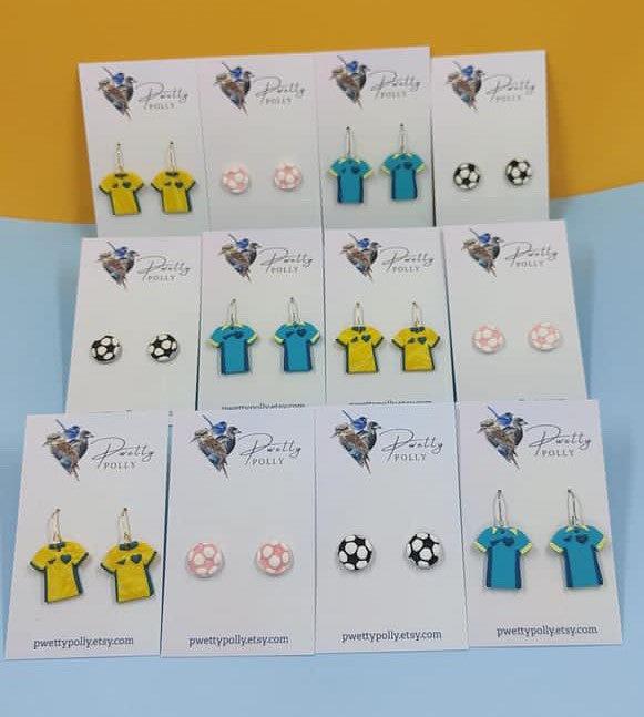 Australian Soccer earrings on a stand